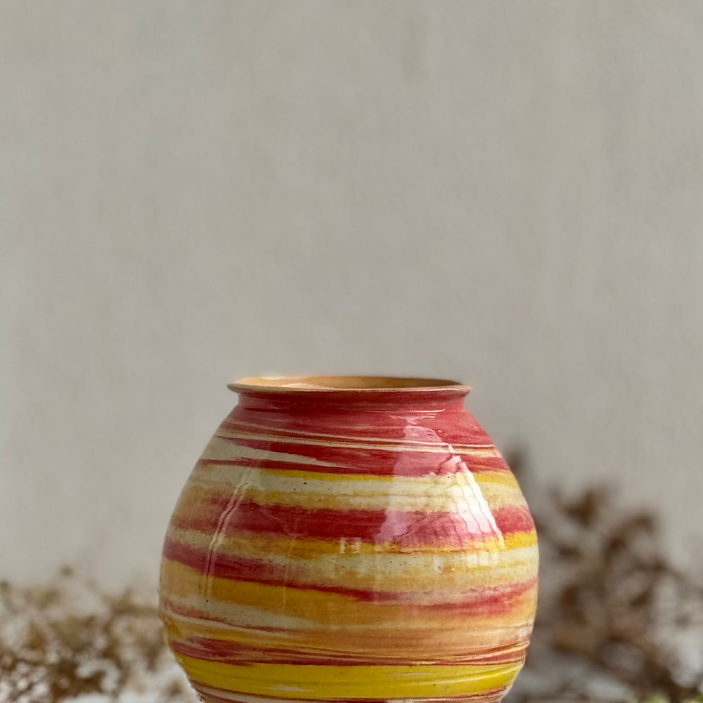 Marigold Swirl Vase against a plain backdrop
