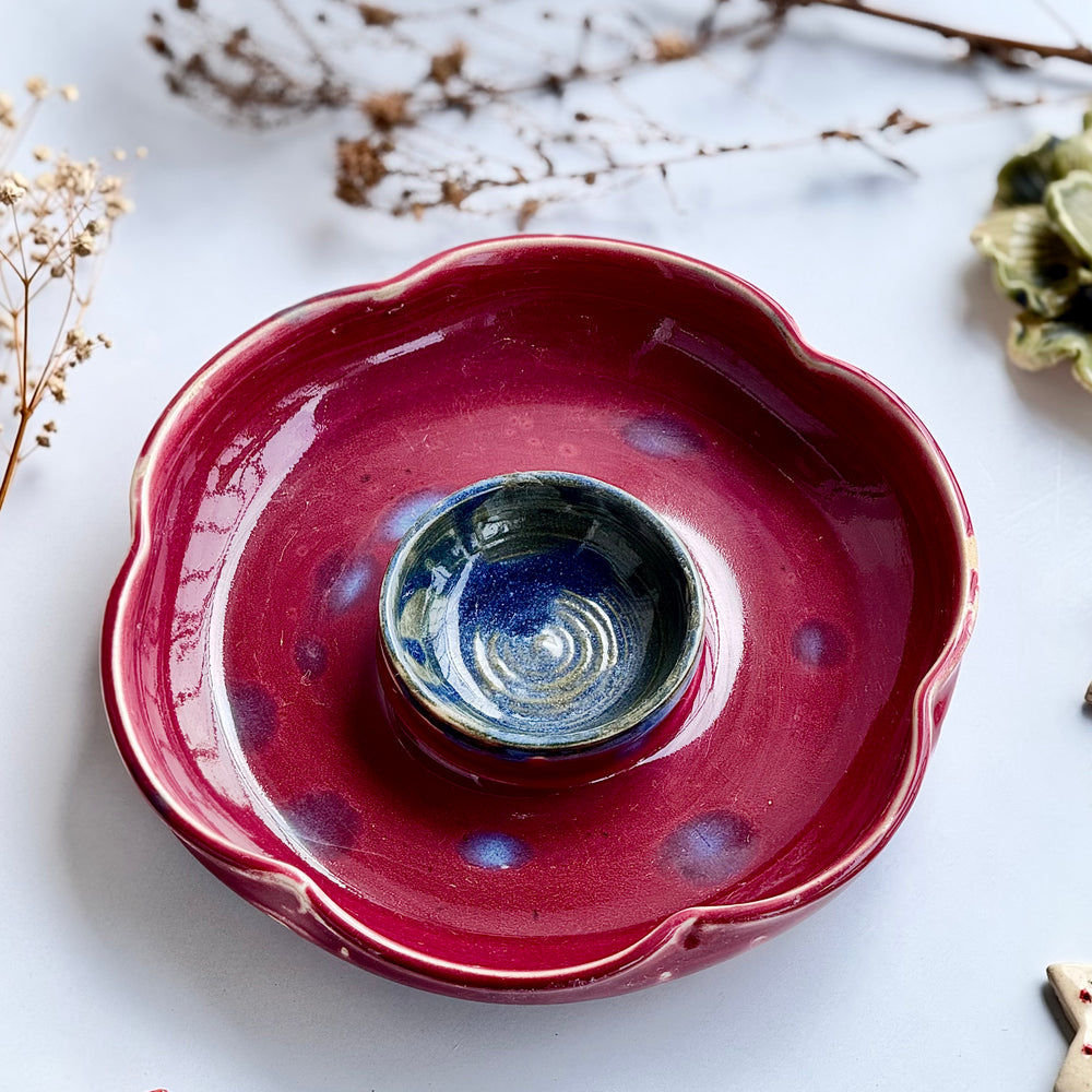 Blossom Dip Dish, base view showing the maroon glaze and foot