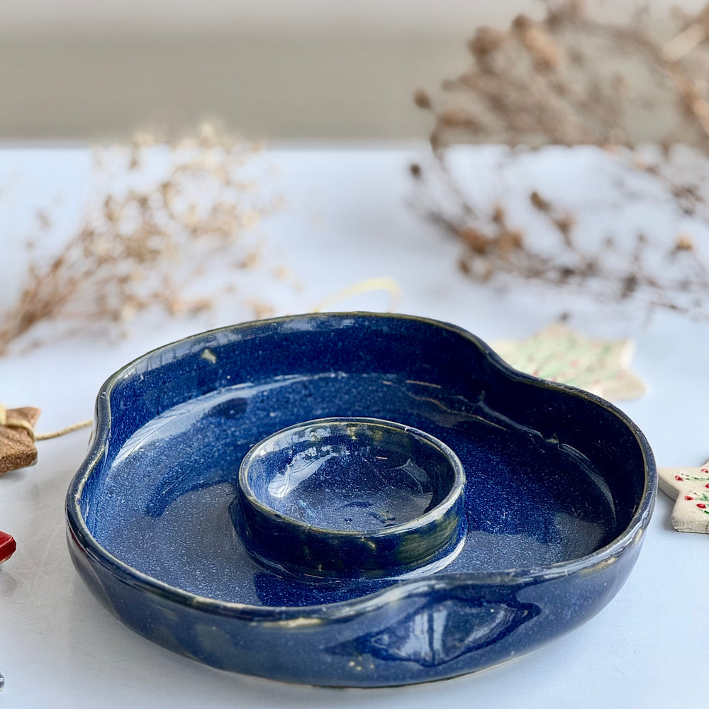 Tidepool Chip Dish, top-down view showing the scalloped blue rim