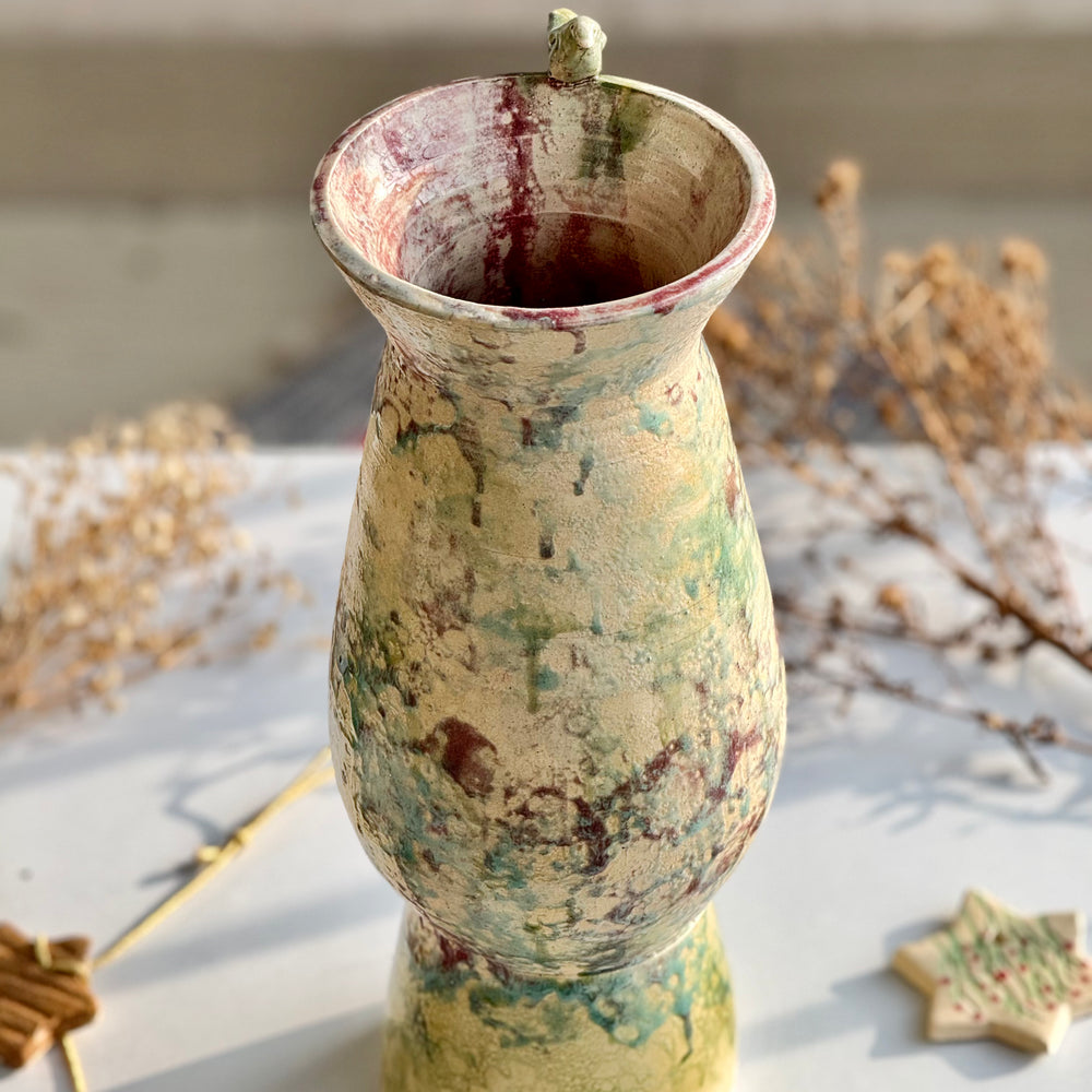Songbird Perch Vase, close view of the speckled glaze and bird detail
