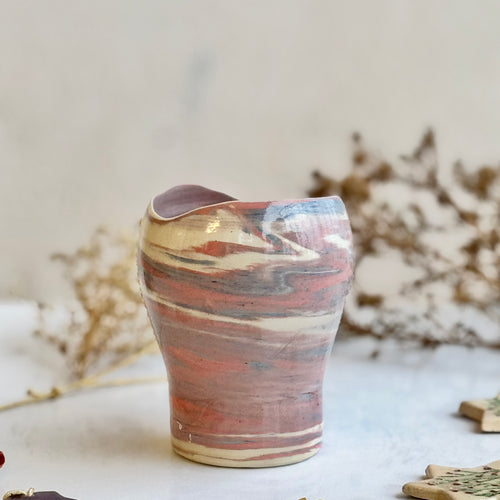 Clay Ribbon Tumbler, front view showing the asymmetric rim