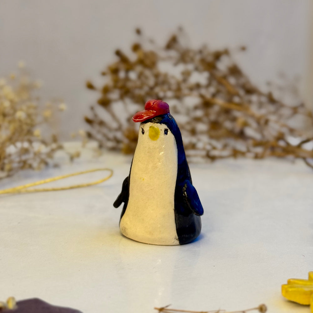 Berry Beanie Penguin, close view of the red hat
