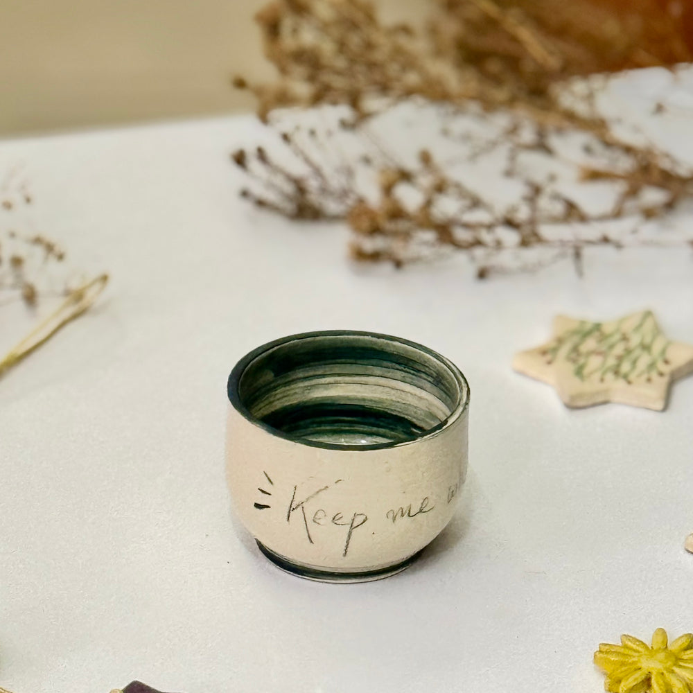 Keepsake Quote Cups, the yellow-glazed cup with handwritten text
