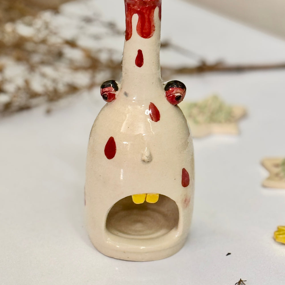 Polka Ghost Tealight, close view of the face and dangling eyes