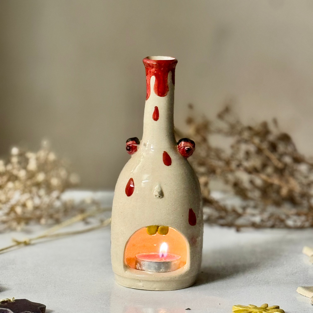 Polka Ghost Tealight with a lit tealight inside