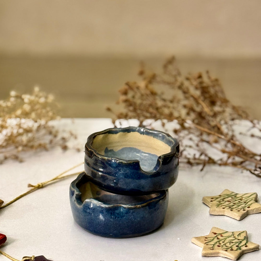 Midnight Moon Vase, front view showing the perforated navy glaze