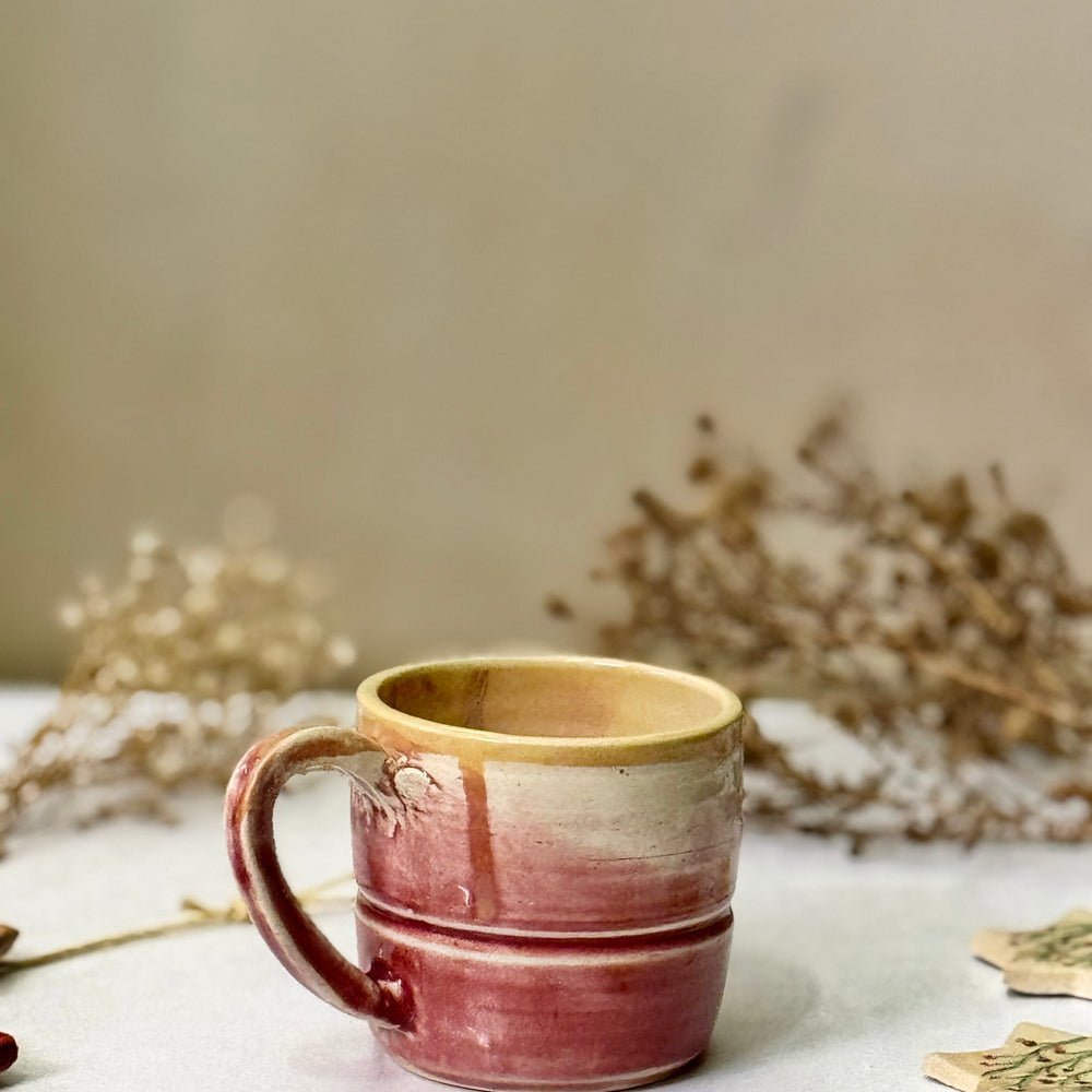 Dusty Rose Mug, front view showing the glaze drips