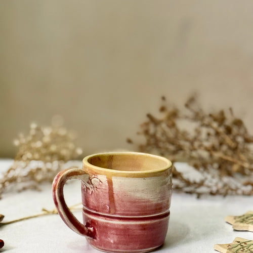 Dusty Rose Mug, front view showing the glaze drips