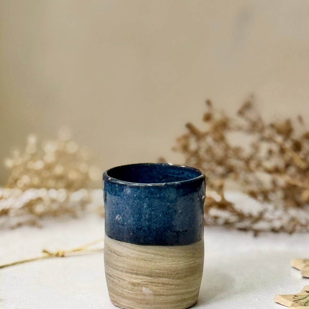 Deep Tide Vase, front view showing the navy-to-stoneware glaze