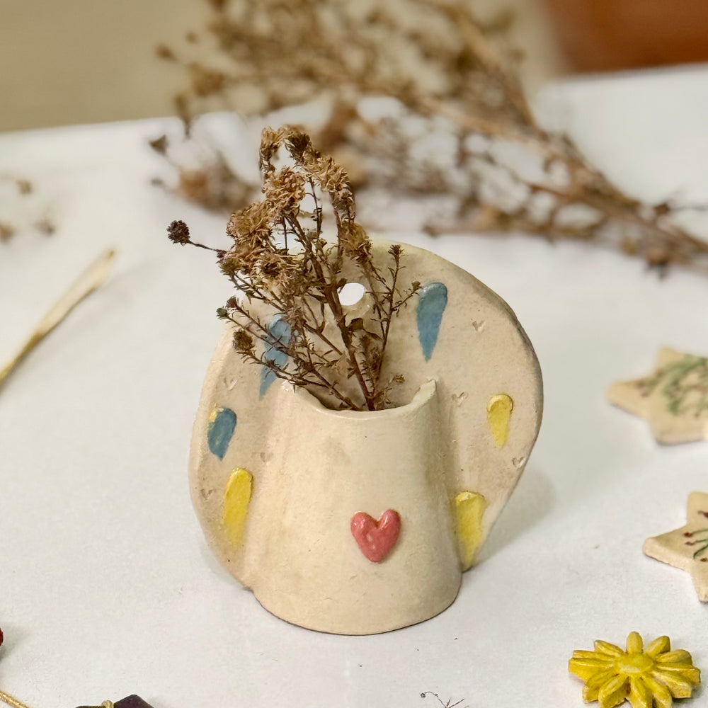 Sweetheart Pocket Vase, close view of the painted heart and raindrop motifs